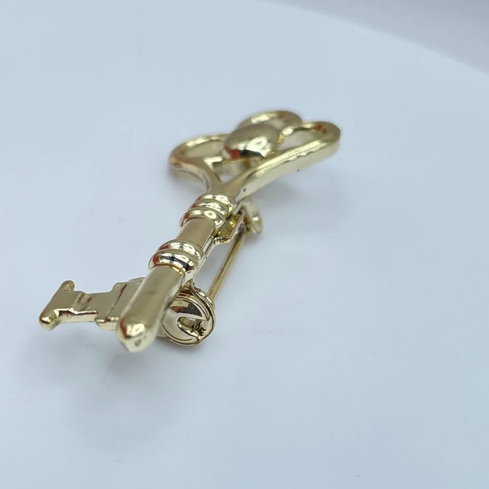 Vintage Gold-Tone Engraved Metal Embellished Skeleton Key Roll-Over Brooch Pin
